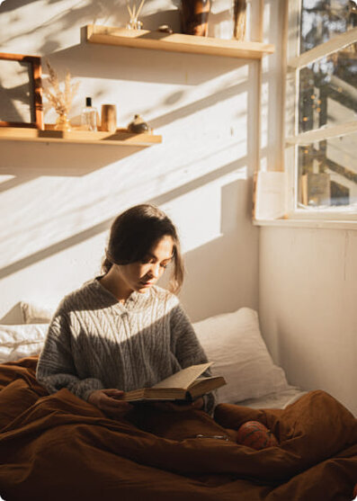 woman reading in the sunlight