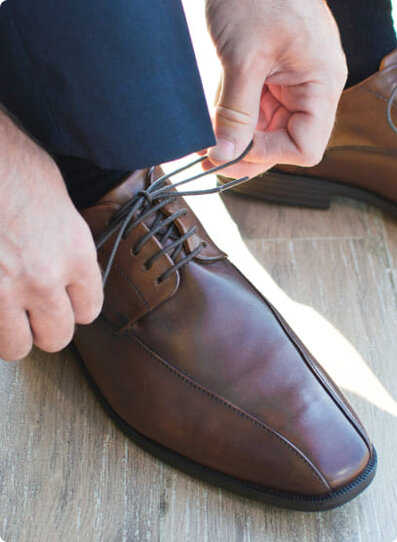 man tying his shoe