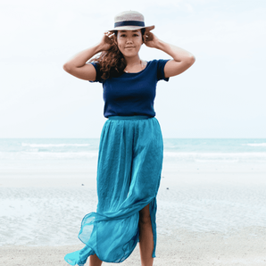 Woman on beach in maxi skirt
