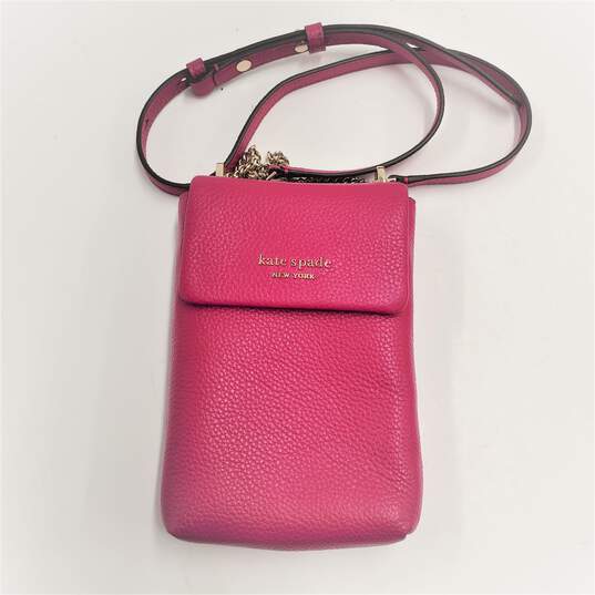 Buy the Kate Spade Roulette North South Crossbody Phone Bag Leather Fuchsia  Color