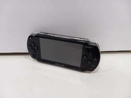 Sony PlayStation Portable Handheld Console & Accessories w/ Metal Case image number 2