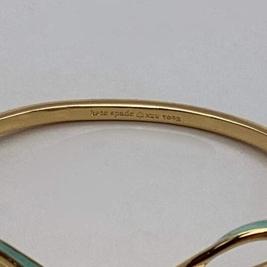 Designer Kate Spade Gold-Tone Enamel Skinny Mini Bow Hinged Bangle Bracelet image number 4