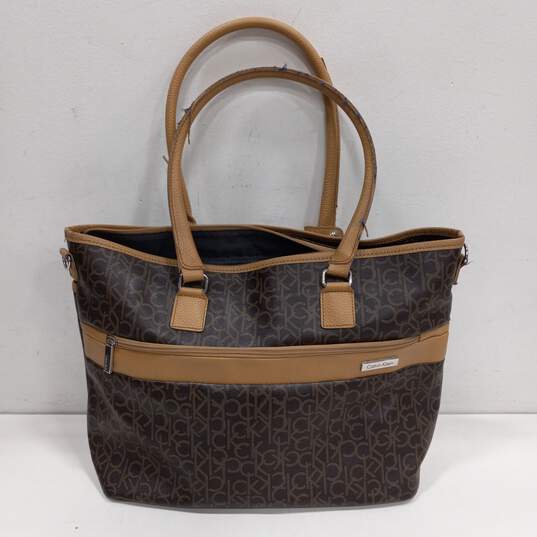 Calvin Klein Large Coated Canvas Brown Purse image number 1