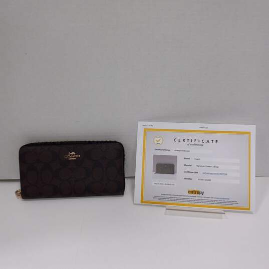 3pc Set of Authenticated Women's Coach Signature Canvas Zip Around Wallets image number 3