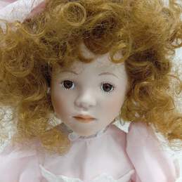 Dynasty Doll Collection Porcelain Doll With Strawberry Blonde Curly Hair And Brown Eyes In Pink Outfit alternative image