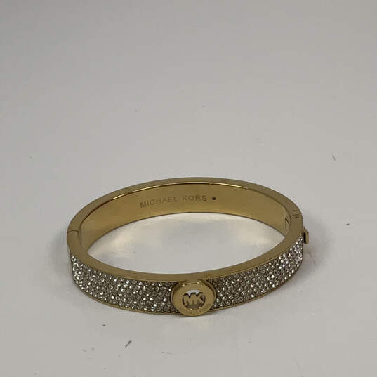 Designer Michael Kors Gold-Tone Shiny Rhinestone Hinged Bangle Bracelet image number 2