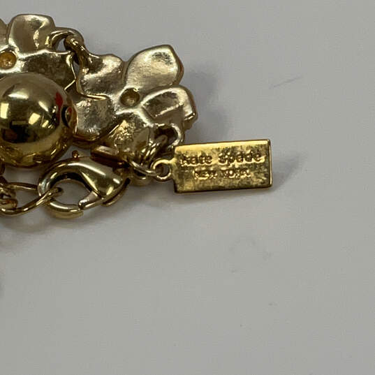 Designer Kate Spade Gold-Tone Rhinestones Twisted Flower Chain Bracelet image number 4
