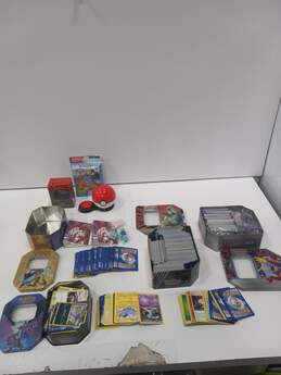 9.1lbs Bundle of Assorted of Pokemon Cards In Tins & Other Merchandise
