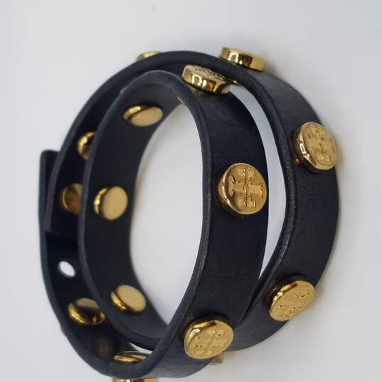 Buy the Tory Burch Black and Gold Leather Wrap Around Bracelet  |  GoodwillFinds