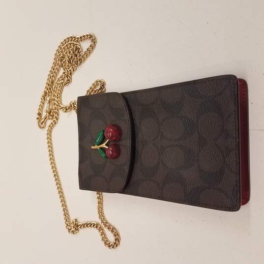 Buy the Coach cherry crossbody phone wristlet wallet | GoodwillFinds