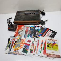 Atari 2600 Video Game Console W/Controller and Assorted Video Game Manuals Untested