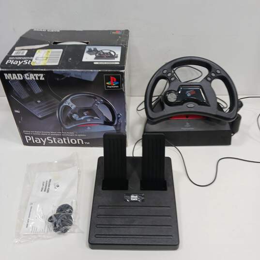 Mad Catz Analog/Digital Steering Wheel W/Foot Pedal for PlayStation IOB image number 1