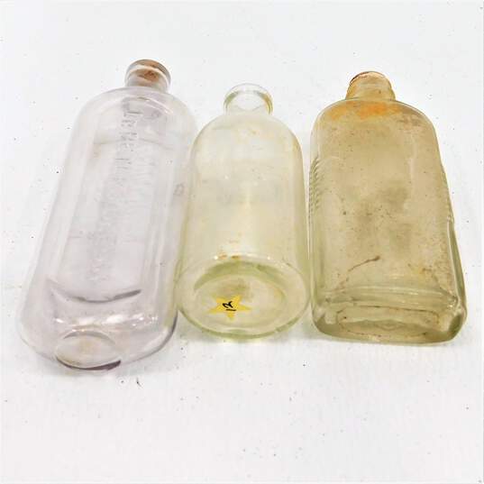 ANTQ Medicine Apothecary Bottles Icy Blue Glass Dr. Miles Oleum Bull Dog Stopper image number 4