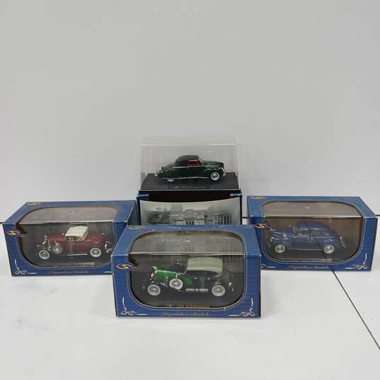 Bundle of 4 Vintage Signature Models Diecast Vehicles image number 1