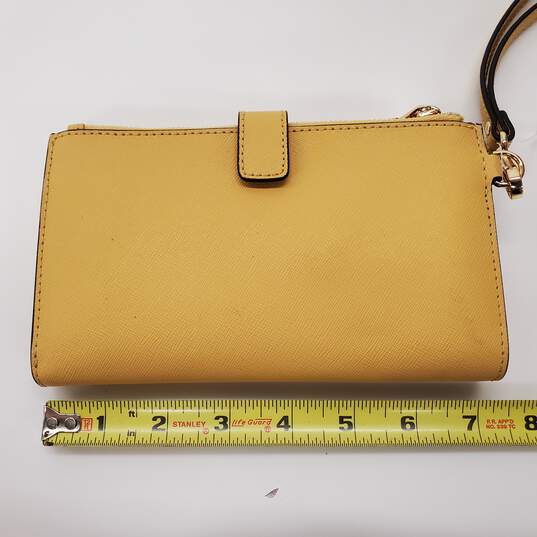 Buy the Michael Kors Yellow Large Snap Clutch Wallet