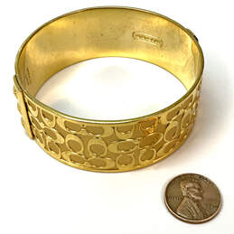 Designer Coach Gold-Tone Signature Print Round Shape Wide Bangle Bracelet alternative image