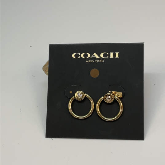 Designer Coach Gold-Tone Clear Crystal Stone Screw Back Hoop Earrings image number 1