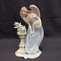 Figurine of Women With Wings Looking At Dove image number 1