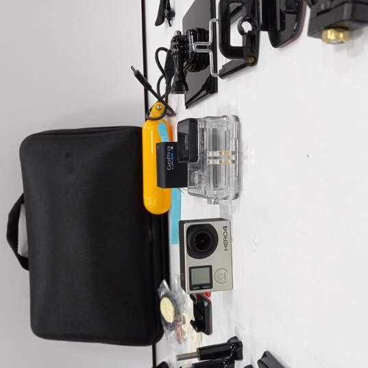 Buy the GoPro 4 Camera and Accessories in Case | GoodwillFinds