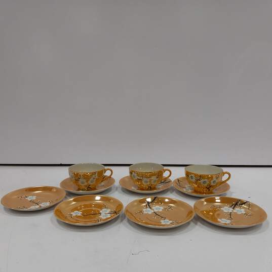 Bundler of 7 Lusterware Peach Tone Floral Themed Plates w/3 Tea Cups image number 1