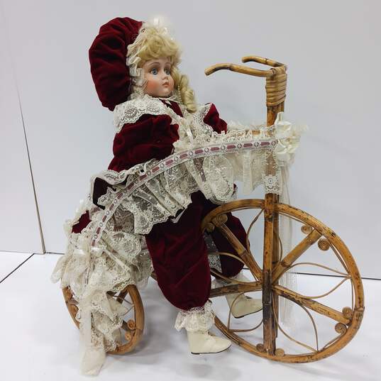 Vintage Porcelain Doll w/Wicker Bike image number 1