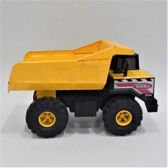 Tonka 354 Mighty Dump Truck Metal Pressed Steel Yellow Hasbro 16" 2012 image number 3