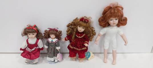 Bundle of 4 Porcelain Dolls image number 1