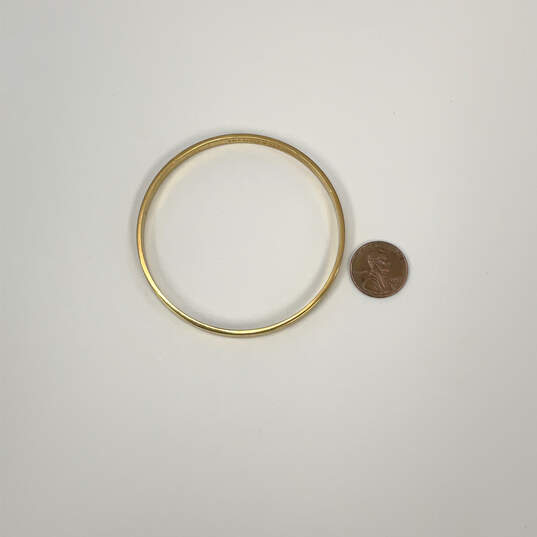 Designer Kate Spade Gold-Tone Round Fashionable Bangle Bracelet image number 3