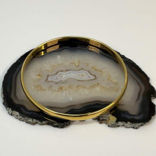 Designer Kate Spade Gold-Tone Heart Of Gold Idiom Bangle Bracelet image number 1