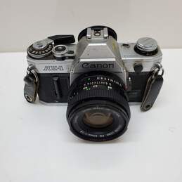 UNTESTED Sliver/Black Canon AE-1 Film Camera Bundle with 3 lenses, Flash & Bag alternative image