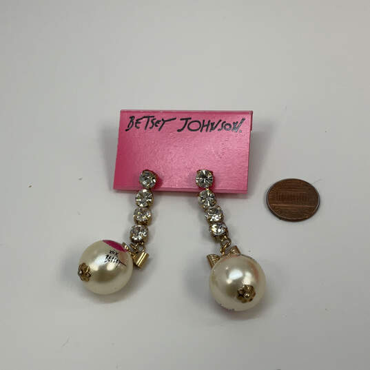 Designer Betsey Johnson Gold-Tone Rhinestone Bow Pearl Dangle Earrings image number 1