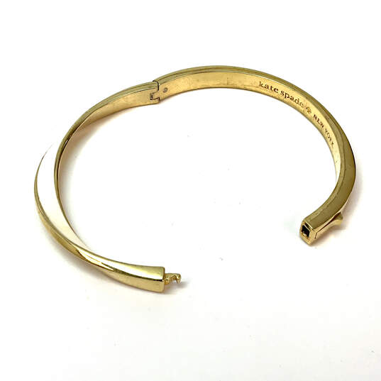 Designer Kate Spade Gold-Tone White Enamel Curved Hinged Bangle Bracelet image number 4