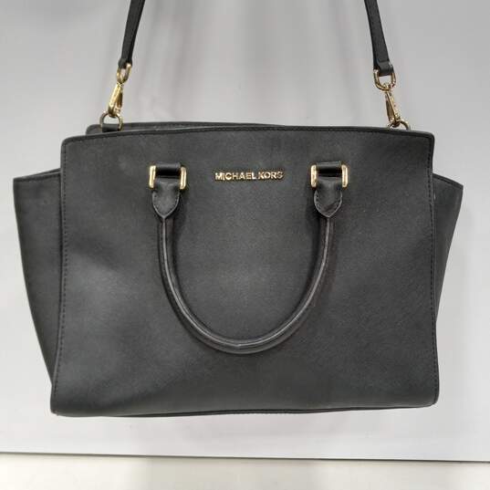 Buy the Pair of Michael Kors Women's Leather Handbags | GoodwillFinds