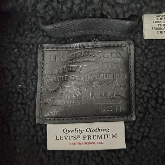 Levi's WM's Black Denim & Boa Sherpa Lining Snap Button Trucker Jacket Size M image number 1