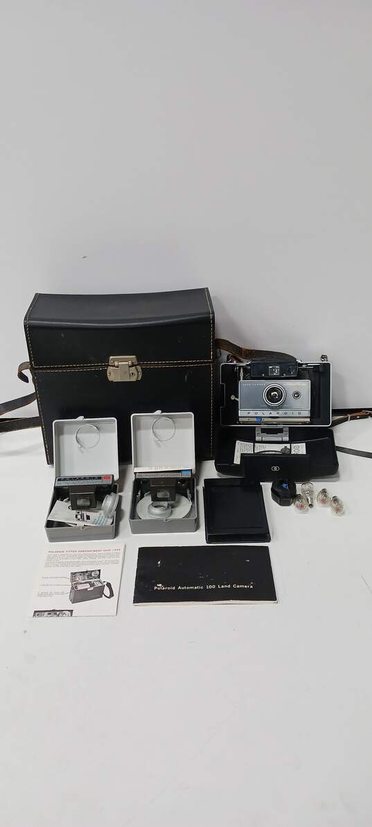 Vintage Polaroid Automatic 100 Land Camera w/ Accessories & Case image number 1