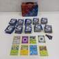 Lot of Assorted Pokemon Trading Cards In Tin image number 1