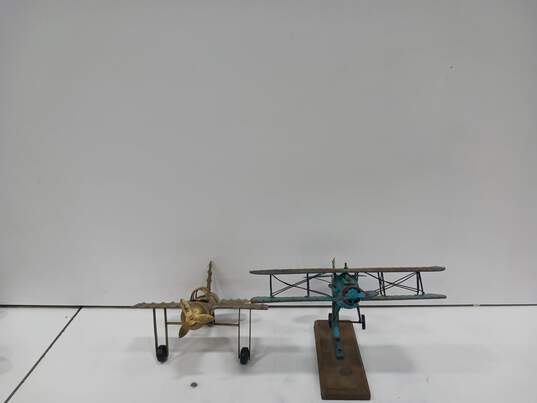 Bundle of Four Metal Airplane Figurines image number 3