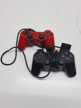 x2 Sony Playstation Controllers Wireless and Corded Black & Red