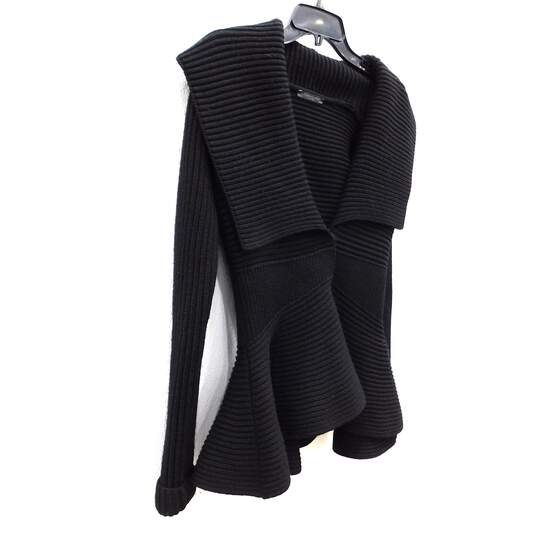 Buy the Alexander McQueen Black Peplum Ribbed Wool Sweater Women's ...