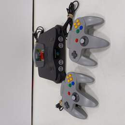 Vintage N64 Game Console with Two Controllers & Cruis'n USA Game