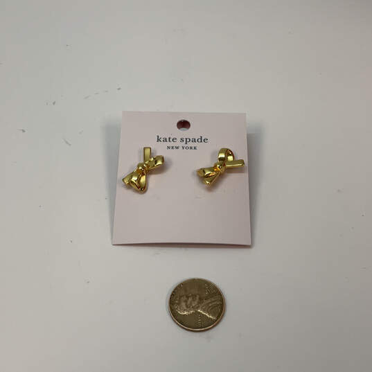 Designer Kate Spade Gold-Tone Skinny Mini Bow Shape Classic Stud Earrings image number 3