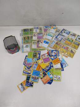 Bundle of Assorted Pokémon Cards In Tin & Sleeves