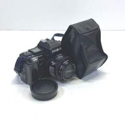 Minolta Maxxum 7000 AF 35mm SLR Camera with 50mm Lens and Flash