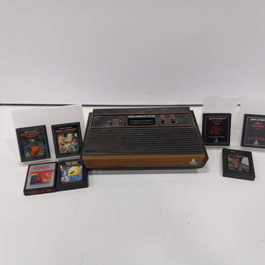 Atari 2600 Console w/ 7 Assorted Games image number 1