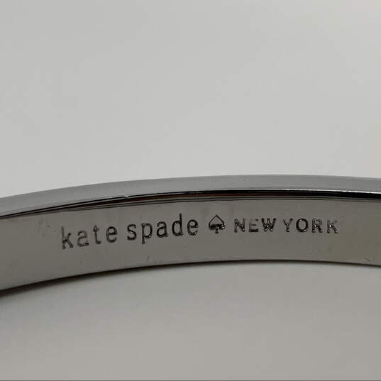 Designer Kate Spade Silver-Tone Rhinestone Bow Hinged Bangle Bracelet image number 3
