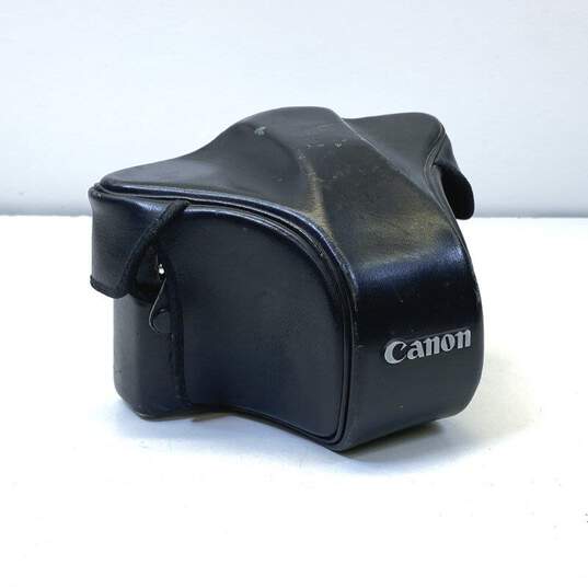 Vintage Canon A-1 SLR Camera w/ Accessories image number 1