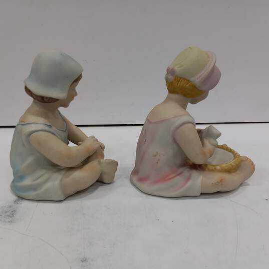 Pair of Ceramic Figurines of Children image number 4