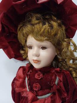 Vintage Doll In Red Velvet Dress alternative image