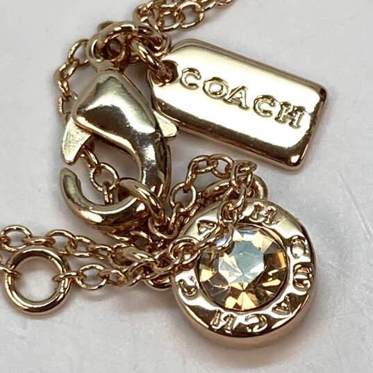 Designer Coach Gold-Tone Link Chain Crystal Round Pendant Necklace image number 2