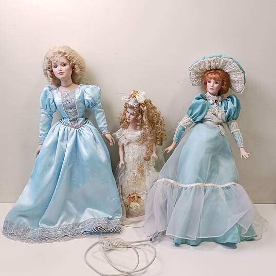Bundle of 3 Assorted Porcelain Dolls w/Dresses image number 1
